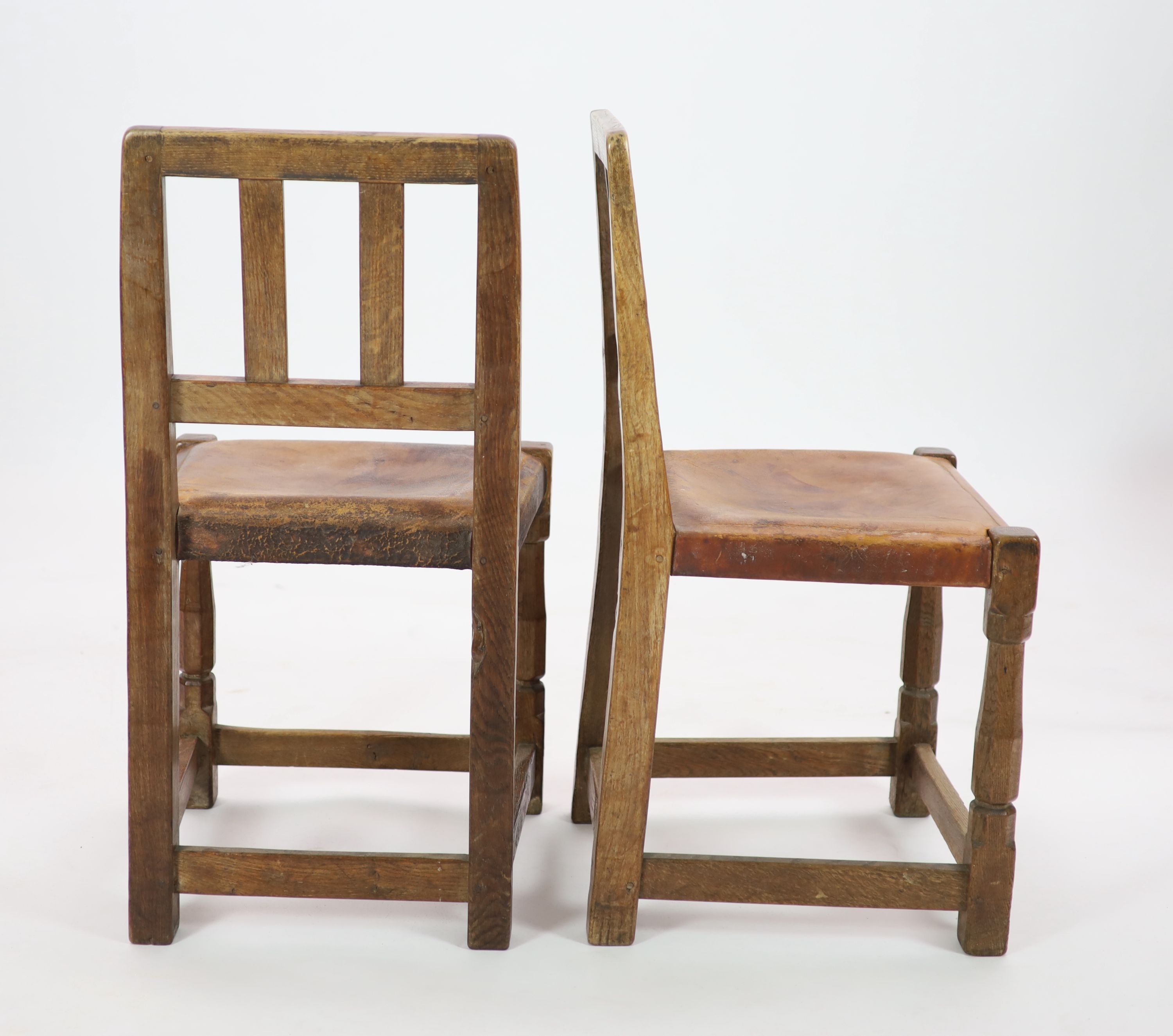 A set of six Robert Thompson 'Mouseman' oak dining chairs